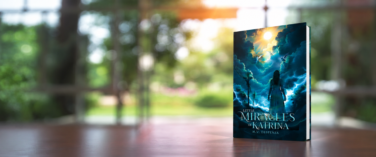 Little Miracles of Katrina by M.V. Despenza displayed on a table